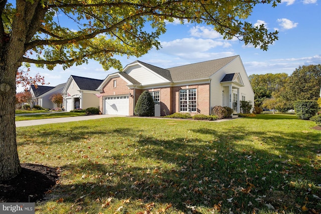 29748 Lyons Dr, Easton, MD 21601 - view of front of house featuring a front lawn, concrete driveway, brick siding, and an attached garage
