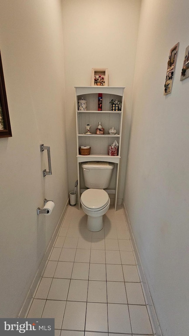 bathroom featuring toilet and tile patterned flooring