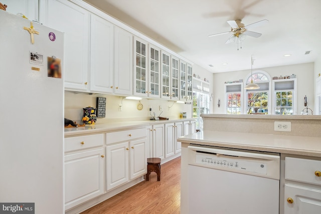 29748 Lyons Dr, Easton, MD 21601 - kitchen featuring a ceiling fan, a wealth of natural light, white appliances, and light wood finished floors