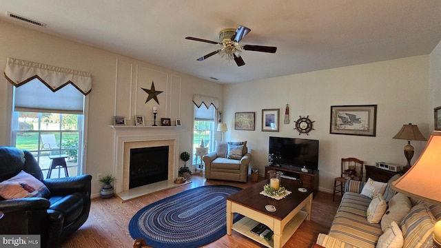 living room with ceiling fan and hardwood / wood-style flooring