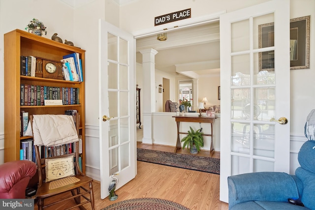 29748 Lyons Dr, Easton, MD 21601 - living area featuring crown molding, ornate columns, and wood finished floors