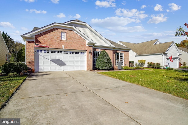 29748 Lyons Dr, Easton, MD 21601 - view of front of home featuring a front lawn, brick siding, driveway, and a garage