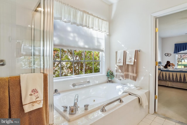 bathroom with independent shower and bath and tile patterned flooring