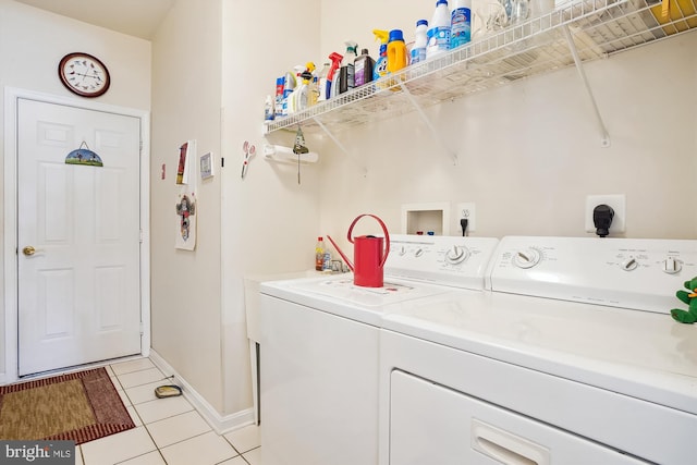 29748 Lyons Dr, Easton, MD 21601 - laundry area with washing machine and clothes dryer, baseboards, laundry area, and light tile patterned flooring