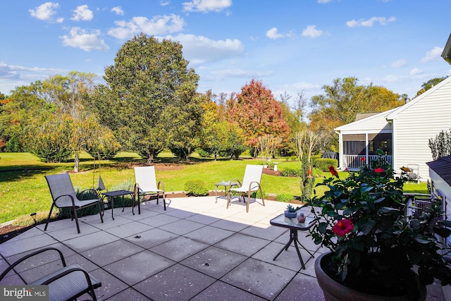 view of patio with a sunroom