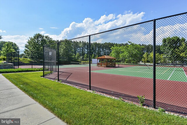 29748 Lyons Dr, Easton, MD 21601 - view of sport court featuring fence and a lawn