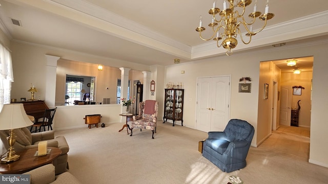 carpeted living room with crown molding, a notable chandelier, and decorative columns