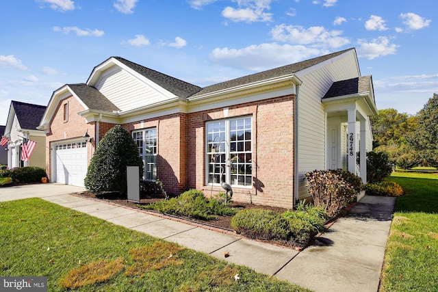 29748 Lyons Dr, Easton, MD 21601 - view of front of property with a garage, concrete driveway, a front yard, brick siding, and roof with shingles