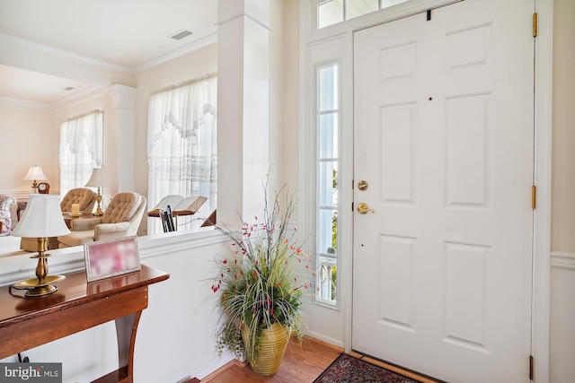 29748 Lyons Dr, Easton, MD 21601 - foyer with a healthy amount of sunlight, crown molding, and wood finished floors