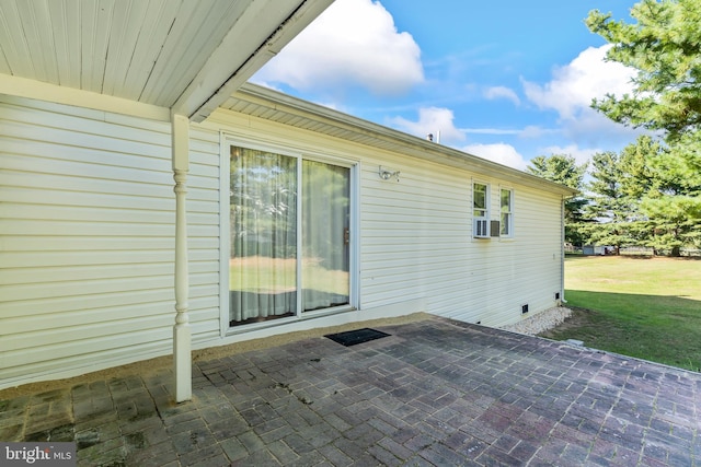 exterior space with a patio, cooling unit, and a yard