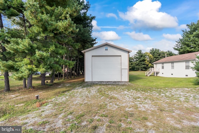 garage with a yard