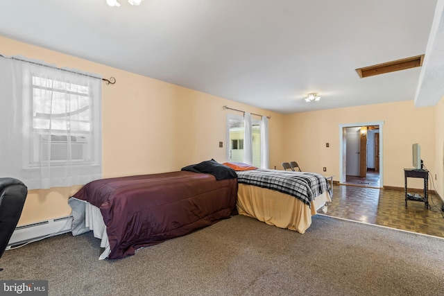 bedroom featuring dark carpet and a baseboard radiator