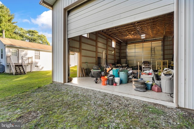 garage featuring a lawn