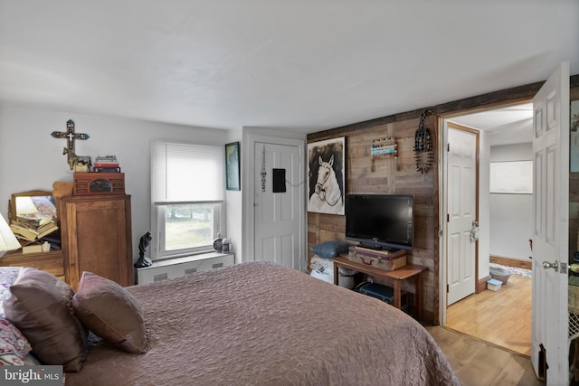 bedroom featuring wood finished floors