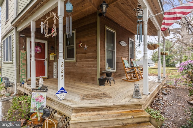 wooden deck featuring covered porch