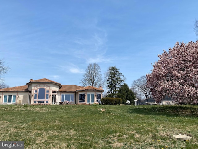 exterior space with a front lawn