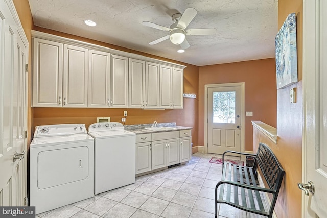 laundry room with sink, light tile patterned flooring, separate washer and dryer, cabinets, and ceiling fan