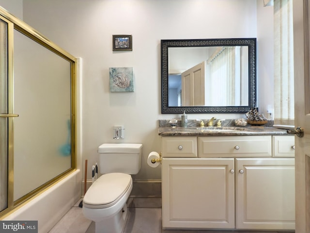 full bathroom featuring vanity, enclosed tub / shower combo, and toilet