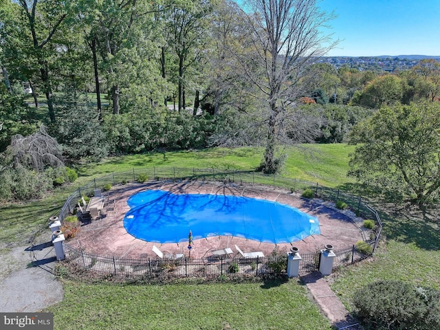 view of pool with a yard and a patio area