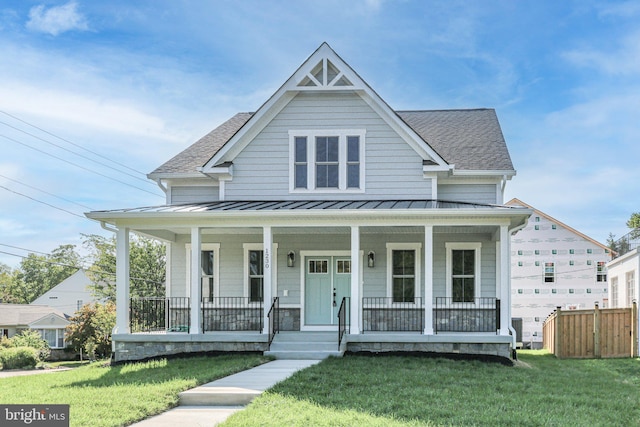 view of front of property featuring a porch and a front lawn