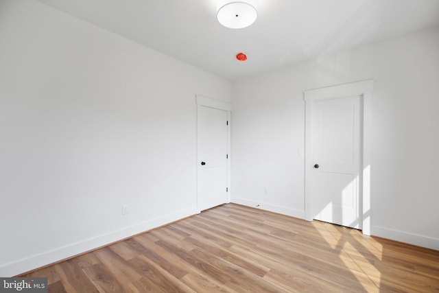 spare room with light wood-type flooring