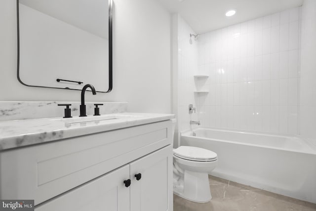 full bathroom with vanity, toilet, and tiled shower / bath combo