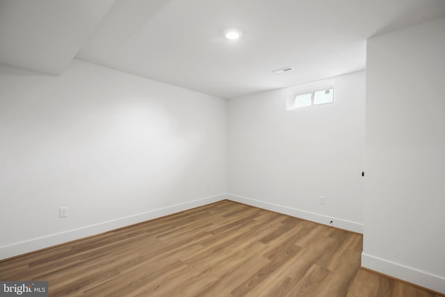 spare room featuring hardwood / wood-style flooring