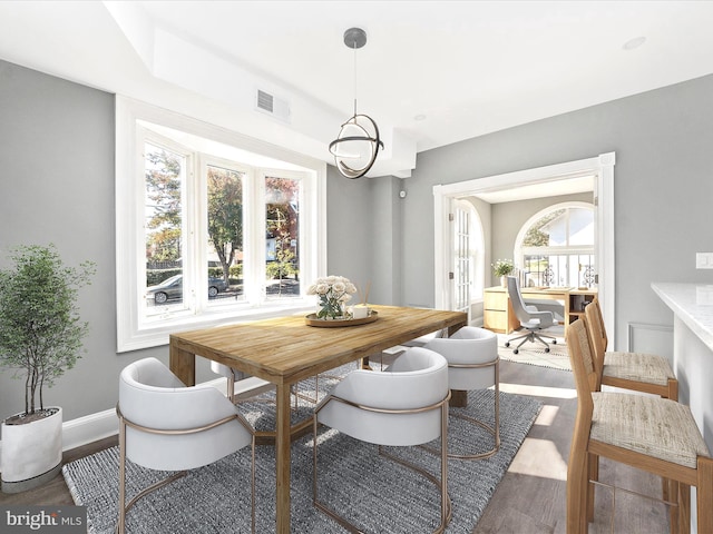 dining area featuring dark hardwood / wood-style flooring