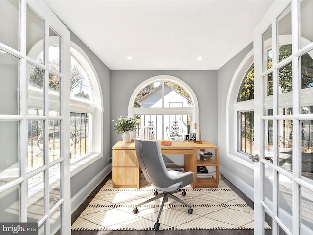 home office featuring hardwood / wood-style floors and plenty of natural light