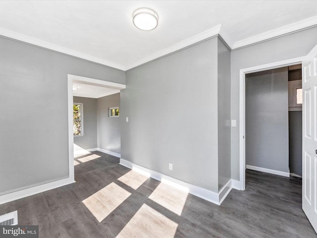 unfurnished room featuring dark wood-type flooring