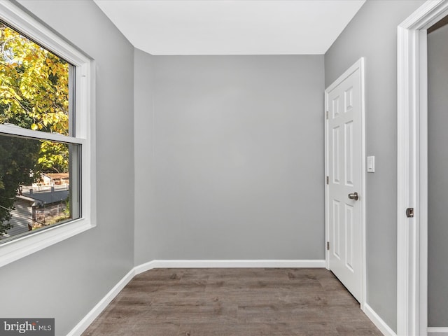 unfurnished room featuring dark hardwood / wood-style floors