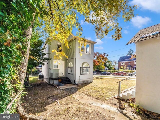 view of property exterior with central AC unit