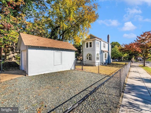 view of side of home with an outbuilding