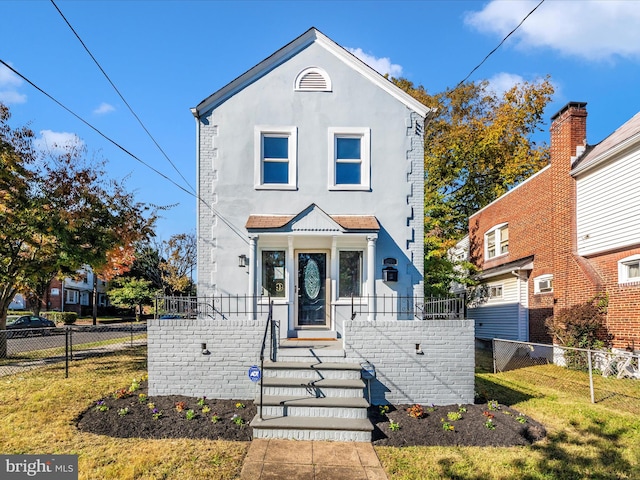 view of front of house with a front lawn