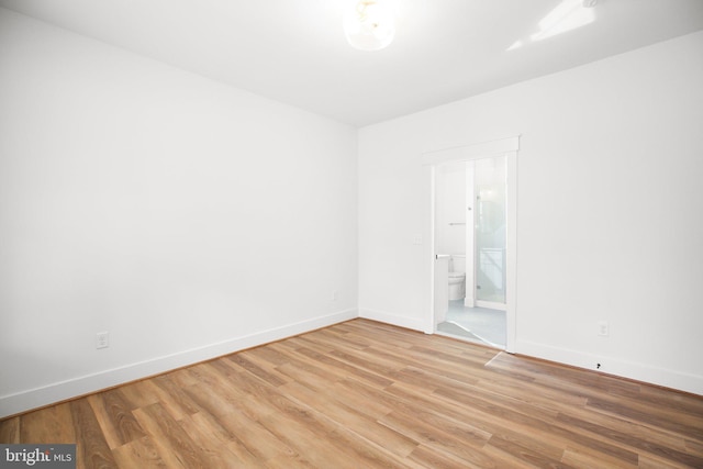 spare room featuring hardwood / wood-style floors