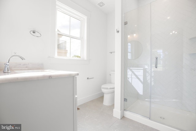 bathroom featuring vanity, toilet, and walk in shower