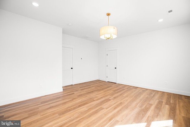 unfurnished room featuring light wood-type flooring