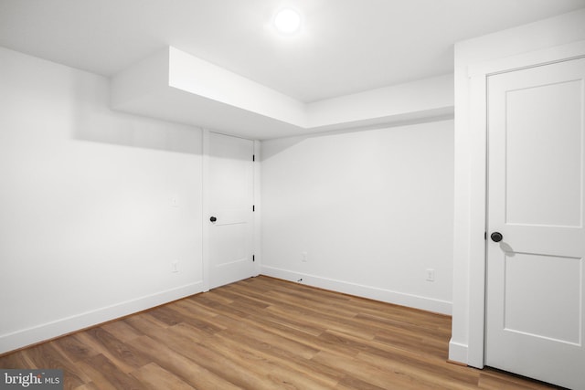 empty room featuring wood-type flooring