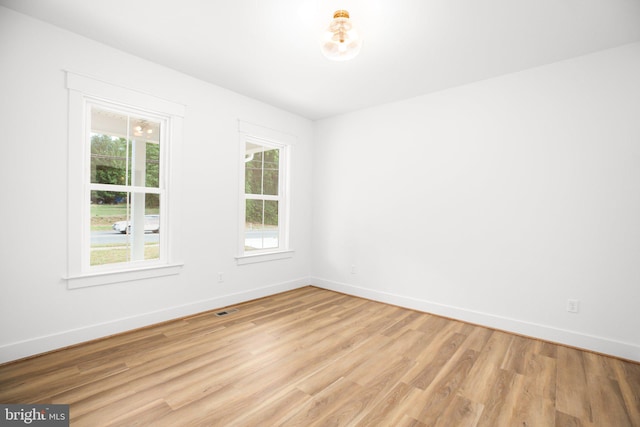 spare room with light hardwood / wood-style floors