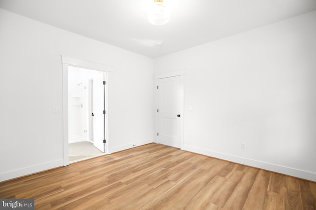 empty room with light hardwood / wood-style floors