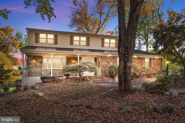 view of property featuring a porch