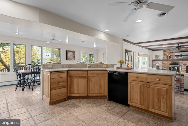 kitchen featuring kitchen peninsula, beam ceiling, black dishwasher, and a brick fireplace