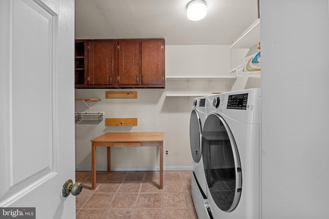 washroom featuring cabinets and independent washer and dryer