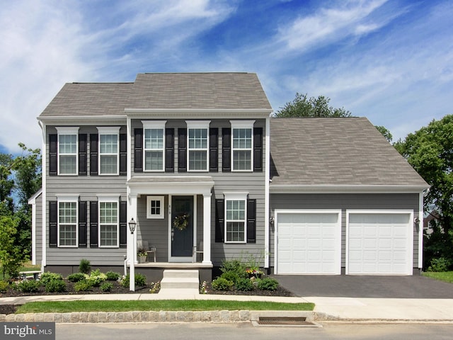 colonial inspired home with a garage