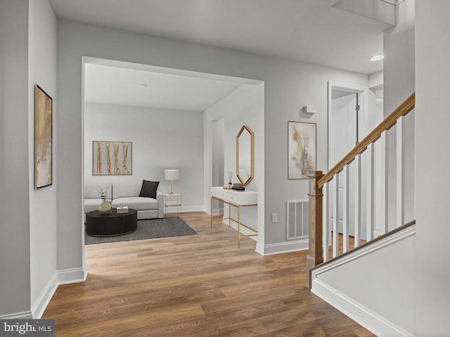 foyer with wood-type flooring