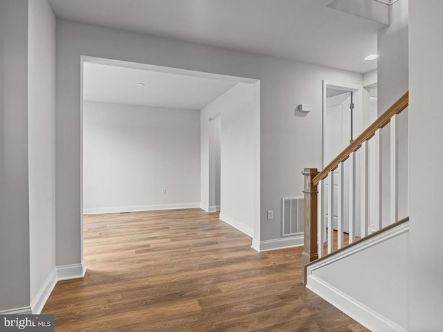 entryway with wood-type flooring