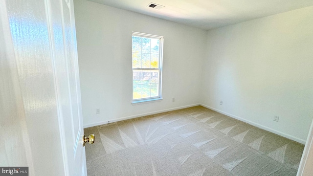 unfurnished room with carpet flooring