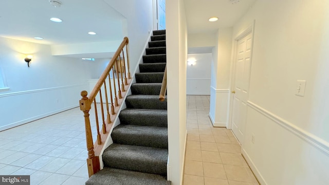 staircase with tile patterned floors