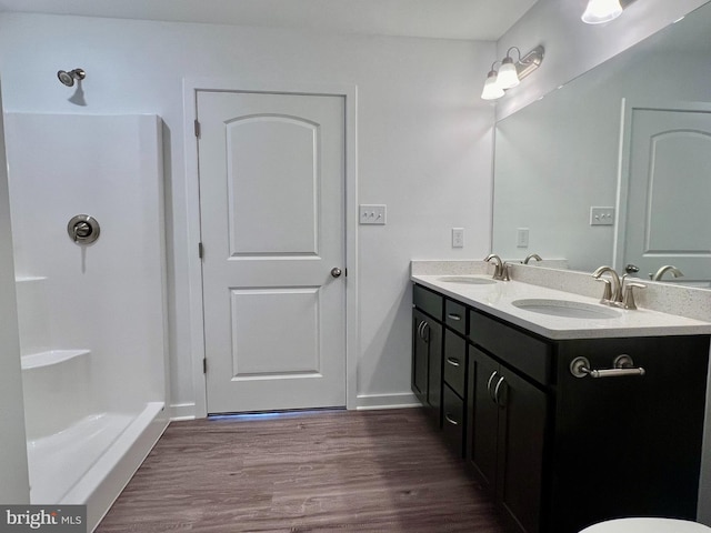 bathroom featuring vanity and hardwood / wood-style flooring