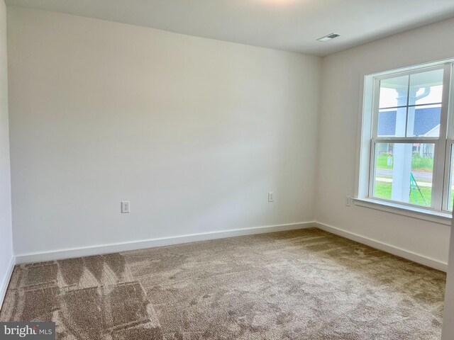 view of carpeted spare room